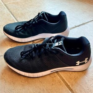 Under Armour women’s tennis shoes. Black and white color, size 9.